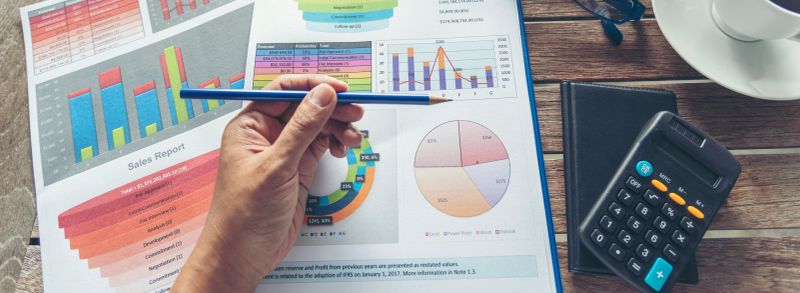 Banner Closeup businesswoman hands working use laptop finance business document reading report paperwork office desk. Banner Excel graph Spreadsheet Document showing Information Financial Startup