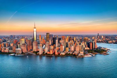 Aerial view of Manhattan skyline at sunset.