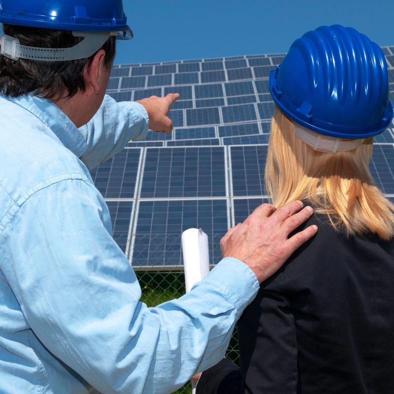 Alternative energy engineers in solar panel site