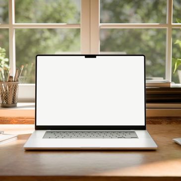 Open laptop with blank screen on wooden desk.