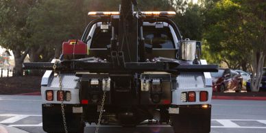 Rear view of a tow truck with equipment on the back.
