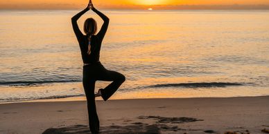 Yoga practitioner in desert twilight.