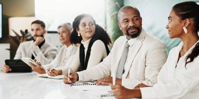 Diverse group having a discussion in a meeting.