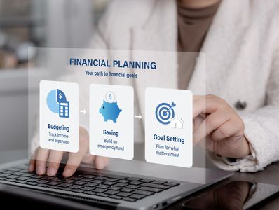 Person planning finances on a laptop with digital financial goals icons.