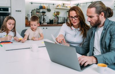 Family spending time together working and drawing at home.