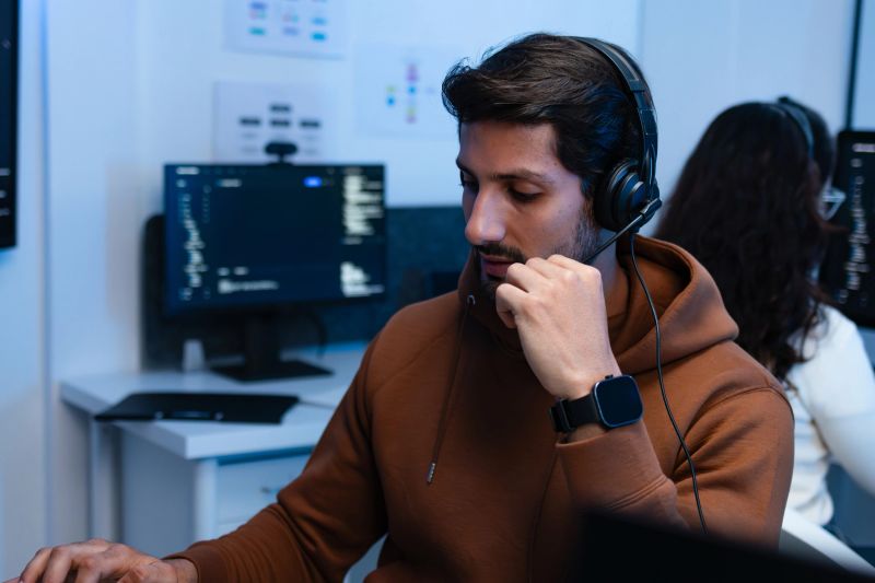 IT Support Agent Reviewing System Issues and Assisting Customer Through Live Support Call.