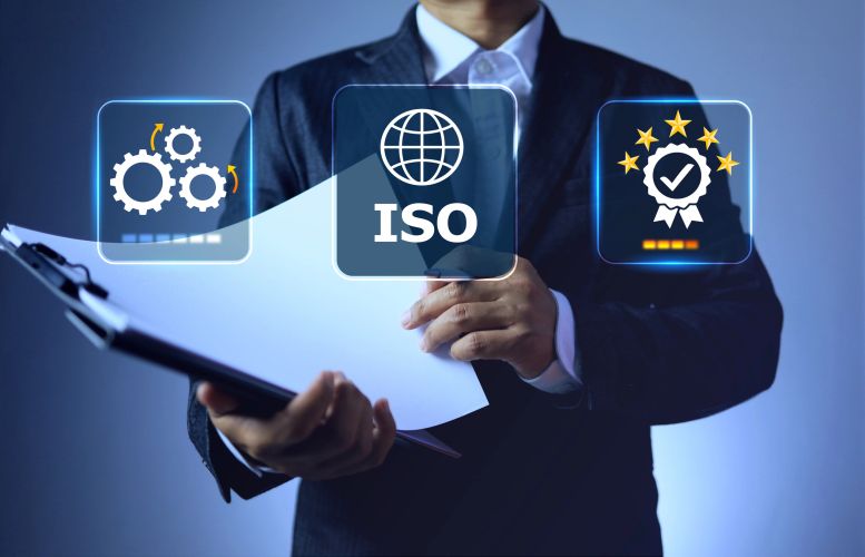Businessman with ISO certification icons and quality gears.