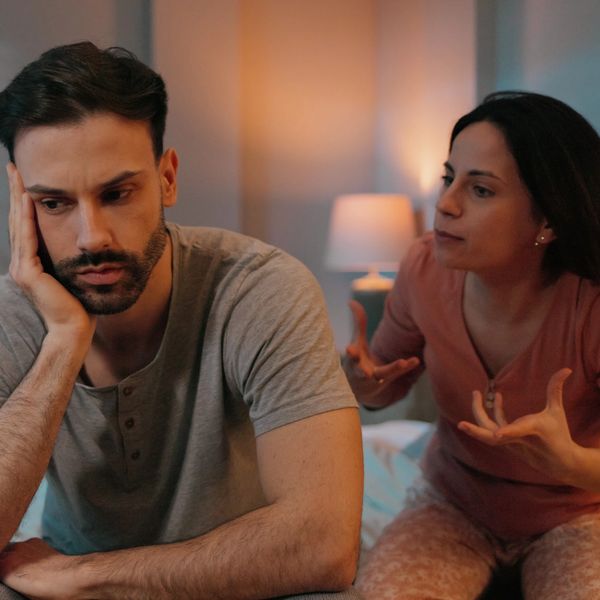 Couple sitting together discussing relationship goals and working through romantic obstacles.