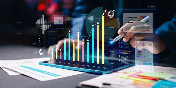 Digital business data analysis with charts and graphs on a tablet.