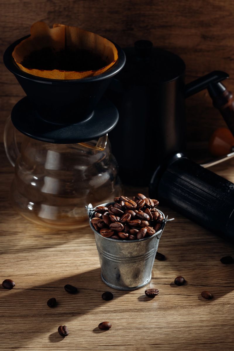 A cozy coffee setup featuring rustic elements. The scene includes brewing equipment, coffee beans, and a warm wooden backdrop, perfect for coffee enthusiasts.