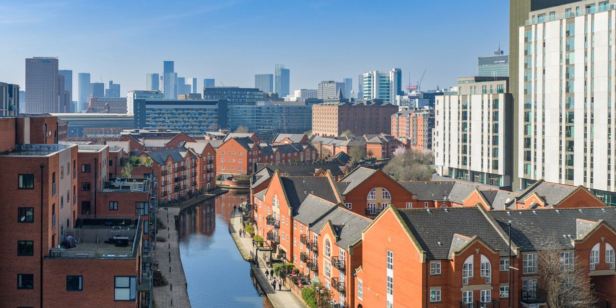 Urban residential area with canal and modern buildings.