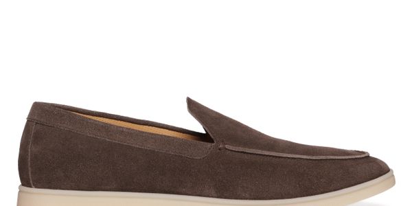 Brown suede loafer with a beige sole on a white background.