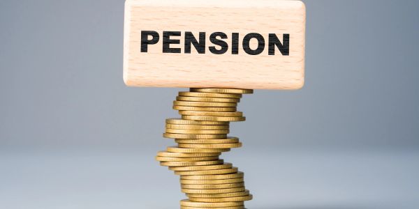 Stack of coins supporting a block labeled 'PENSION'.
