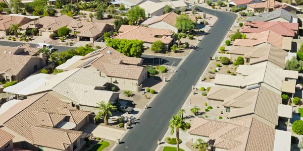 Aerial view of a suburban neighborhood street.