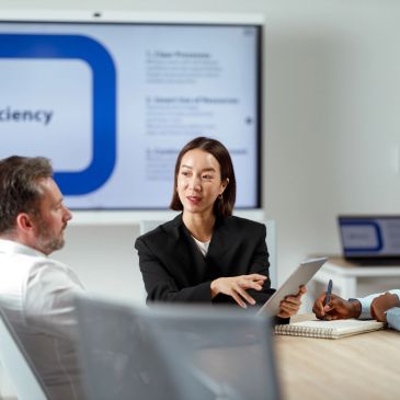 Professionals discussing business strategy in a meeting.