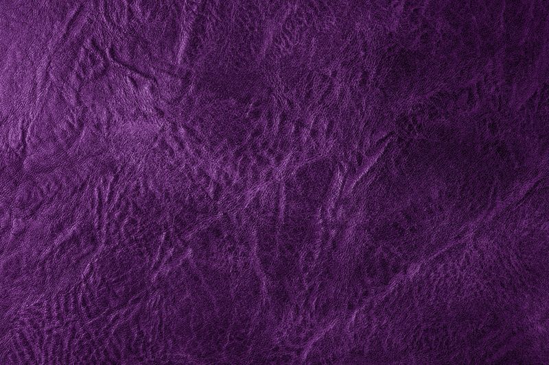 Luxurious deep purple fabric exuding elegance, perfect for backgrounds in design.