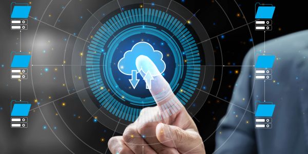 Hand interacting with cloud computing icon on screen.