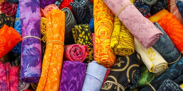 image of quiltig cotton rolled into fat quarters.