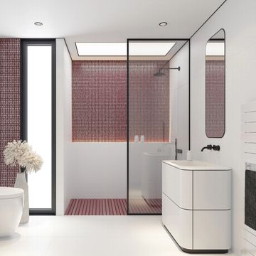 Modern bathroom with red mosaic tiles and glass shower.