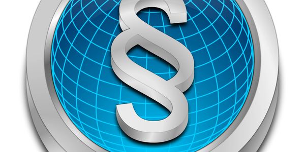 A silver paragraph symbol on a blue globe background.