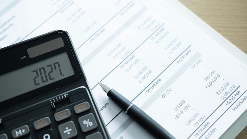 Financial forecast and cash flow projection charts on a desk with planning documents
