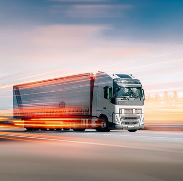 Courier with boxes in motion.