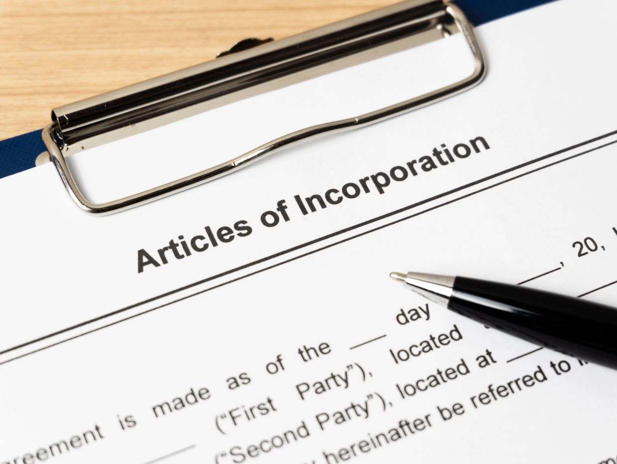 Pen on Articles of Incorporation document.