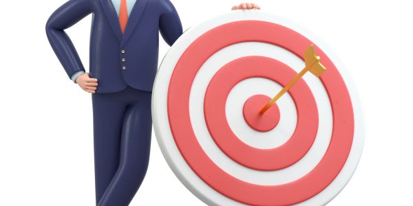 Businessman with bullseye target and arrow.