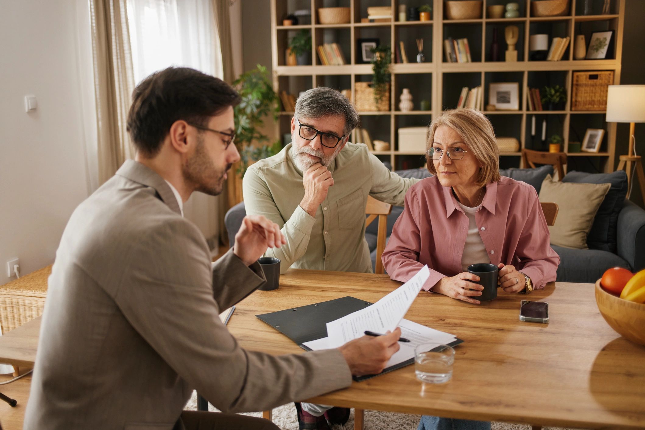 Couple discussing important documents with a professional.
