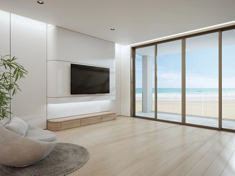 Sea view through large glass window beach house for calm vacation copy space product mockup.