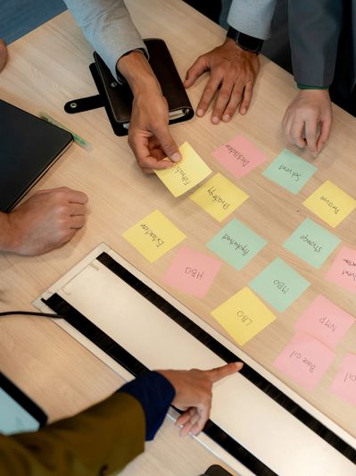People using sticky notes during a meeting.