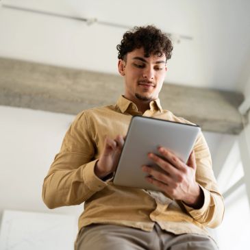 Person analyzing digital data charts on laptop.
