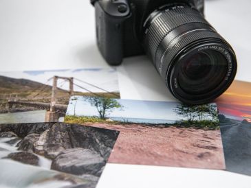 Camera with printed landscape photos.