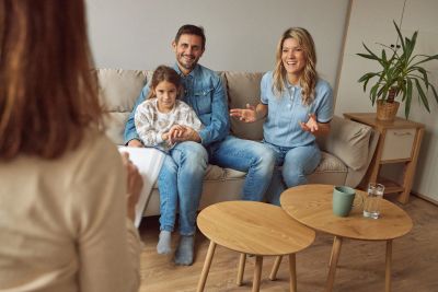 Family therapy session with parents and child.