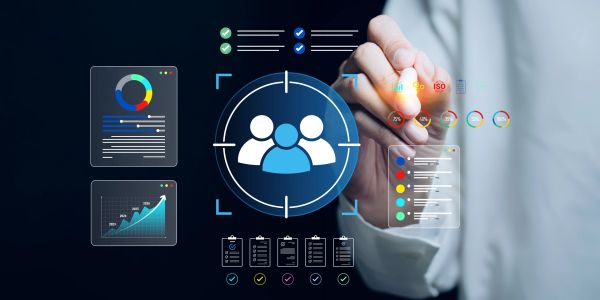 Person interacting with digital data analytics and user targeting interface.