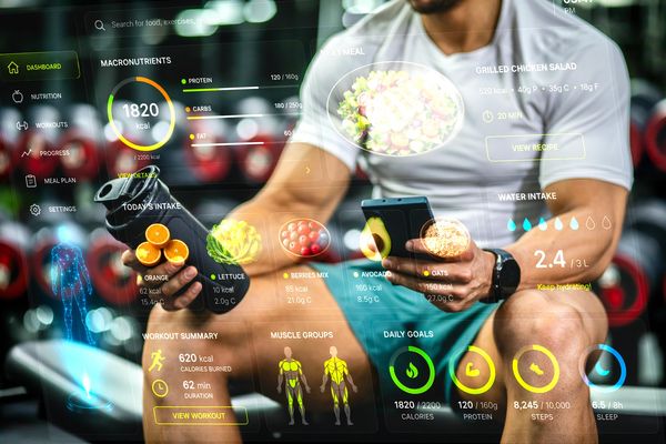 Man using fitness and nutrition app with holographic display.