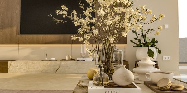 Elegant living room with flowers and decorative items.