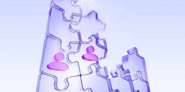 Transparent puzzle pieces with pink user icons fit together symbolizing connection.