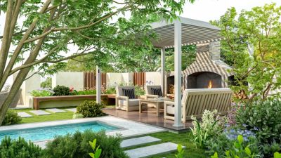 Cozy outdoor seating area with fireplace and pool in a lush garden.