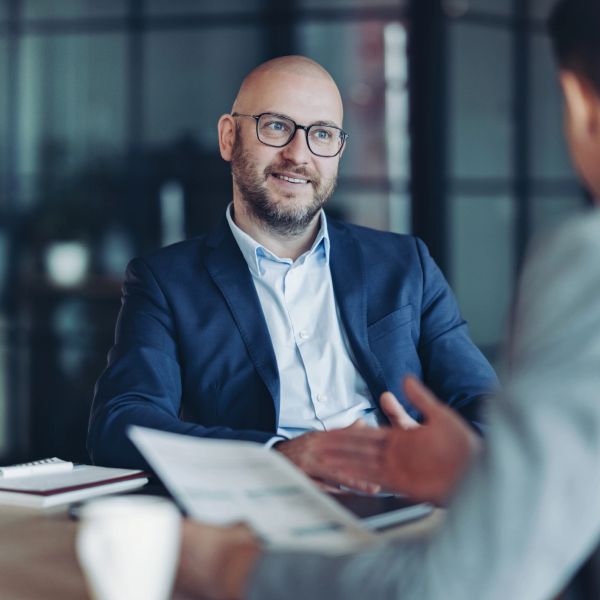 Smiling businessman in a meeting.