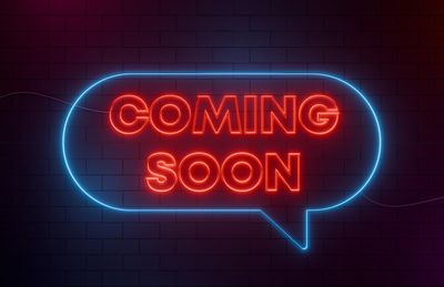 Neon sign saying Coming Soon.