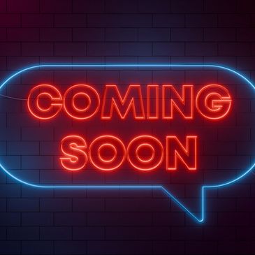 Neon sign saying Coming Soon in a speech bubble.