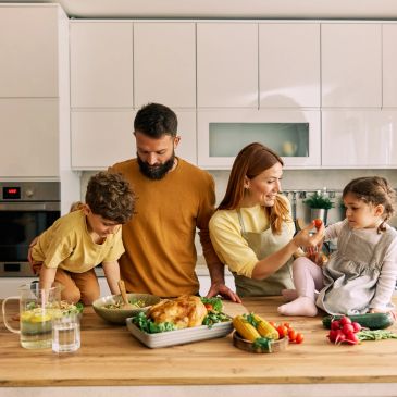 Family cooking and enjoying time in the kitchen together.