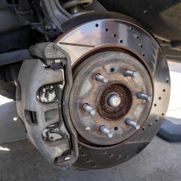 Close-up of a car brake disc and caliper.