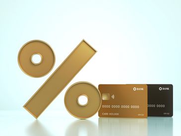 Gold percentage symbol with credit cards.