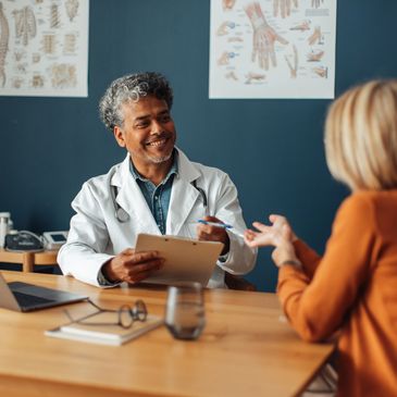Doctor consulting with a patient in an office.