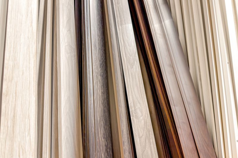 A variety of wood trim samples are displayed vertically.