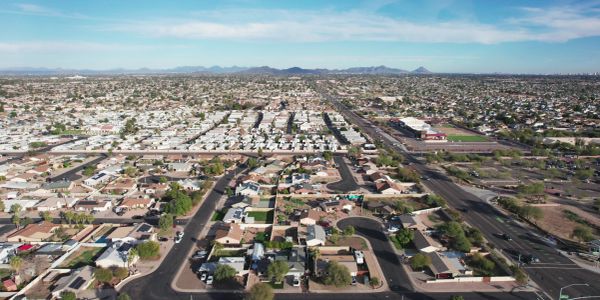 Aerial view of a suburban neighborhood with clear skies.