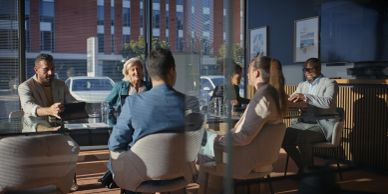 Group of colleagues having a discussion in a modern office.