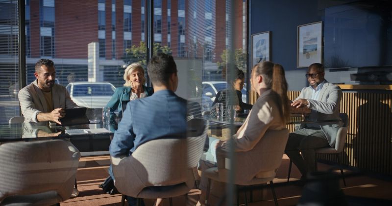 Business, people and meeting in boardroom with discussion, strategy or review human resources policy. Team, talk and planning in office with collaboration, HR management or compliance for work rules.